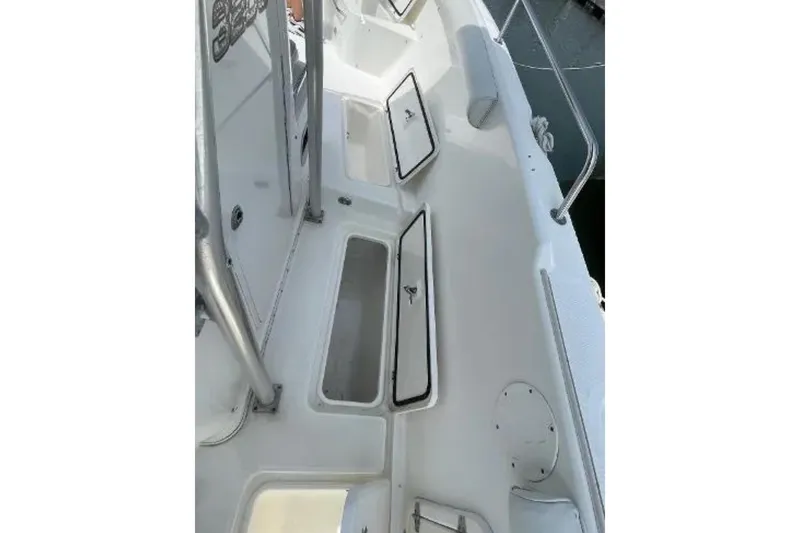 Slide: The Image of 2004 Century 3200 Center Console boat interior with open storage compartments. - 41