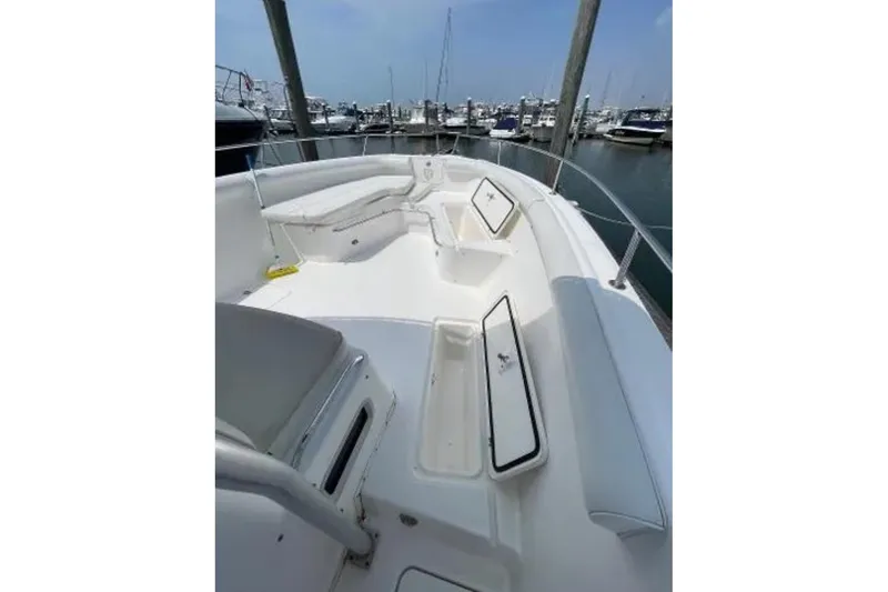 Slide: The Image of 2004 Century 3200 Center Console boat with spacious deck and storage compartments. - 43