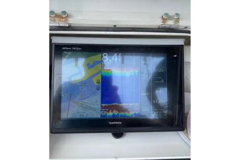 Slide: The Image of Garmin GPS display on 2004 Century 3200 Center Console boat dashboard. - 56