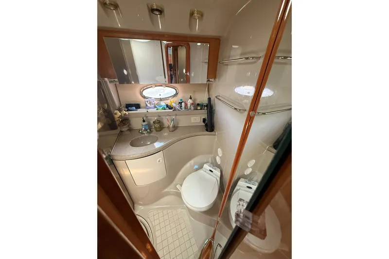 Slide: The Image of Luxurious bathroom in 2002 Regal Commodore 3860 yacht with modern amenities. - 12
