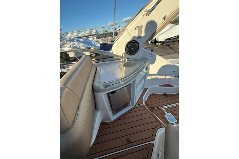 Slide: The Image of 2002 Regal Commodore 3860 boat interior with seating, sink, and speaker. - 17