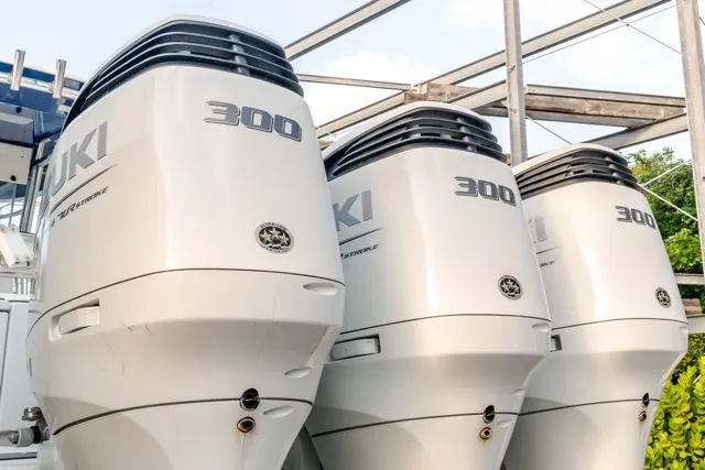 Slide: The Image of Triple Suzuki 300 outboard engines on a 2015 Bahama 34 boat. - 37