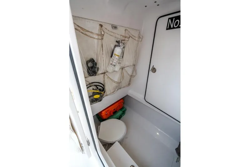 Slide: The Image of Interior of 2015 Bahama 34 boat with storage and safety equipment. - 62