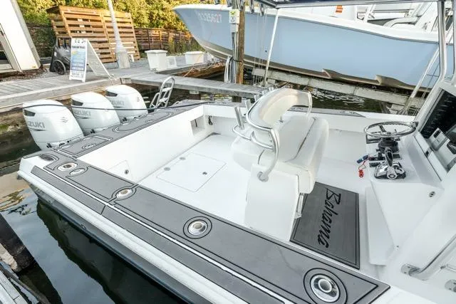 Slide: The Image of 2015 Bahama 34 boat with Suzuki engines docked at marina. - 20