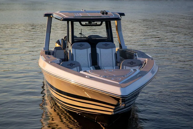 Slide: The Image of Manufacturer Provided Image: 2025 Fountain 39 SCX boat on calm water at sunset. - 4