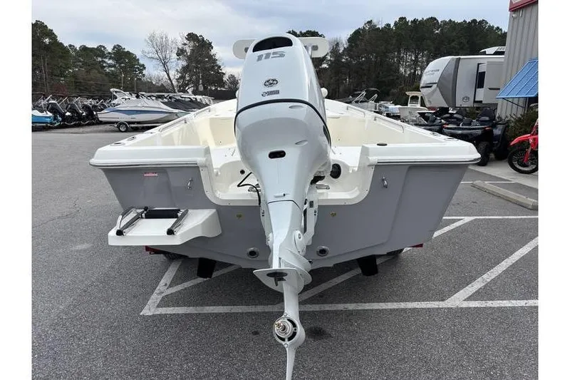 Slide: The Image of 2026 Bulls Bay 2000 boat with outboard motor in parking lot. - 10