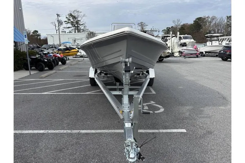 Slide: The Image of 2026 Bulls Bay 2000 boat on trailer in parking lot, surrounded by other vehicles. - 3