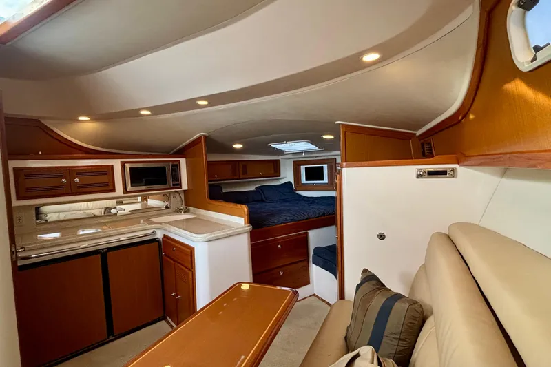 Slide: The Image of Interior of 2004 Cabo 35 Express Sportfish with cozy seating and modern amenities. - 8