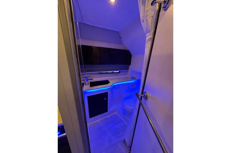 Slide: The Image of Interior of 2020 Formula 400 Super Sport Crossover boat bathroom with modern lighting. - 14