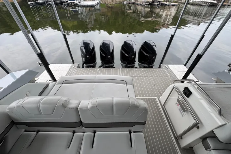 Slide: The Image of 2020 Formula 400 Super Sport Crossover boat with four Mercury outboard engines. - 25