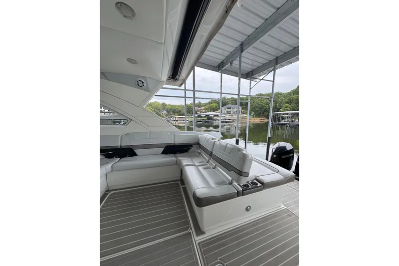 Slide: The Image of 2020 Formula 400 Super Sport Crossover boat interior with luxurious seating and lake view. - 29