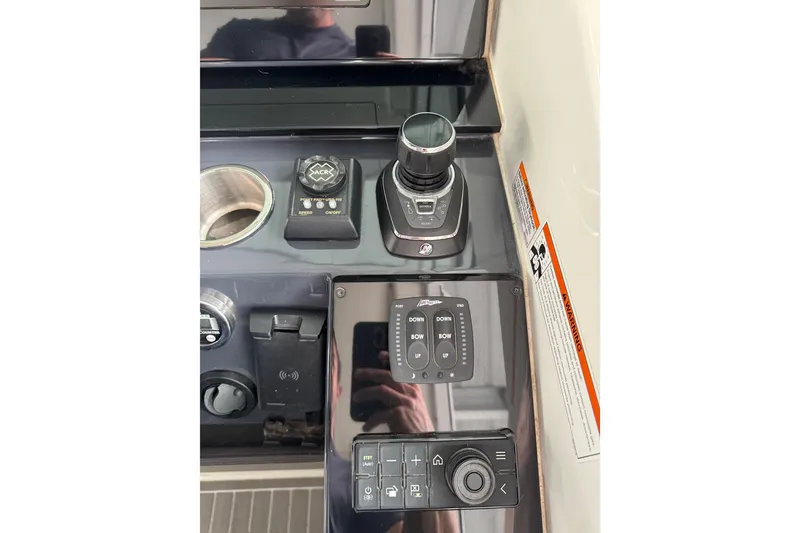 Slide: The Image of Control panel of 2020 Formula 400 Super Sport Crossover boat with joystick and buttons. - 34