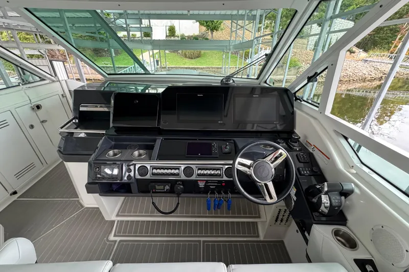 Slide: The Image of 2020 Formula 400 Super Sport Crossover helm with advanced navigation controls and sleek design. - 37