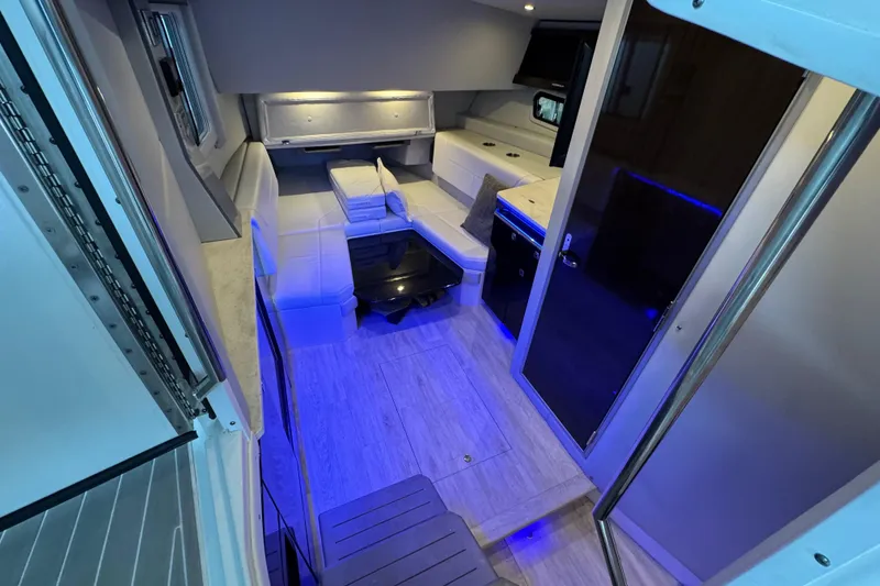 Slide: The Image of Interior of 2020 Formula 400 Super Sport Crossover with modern seating and ambient lighting. - 47