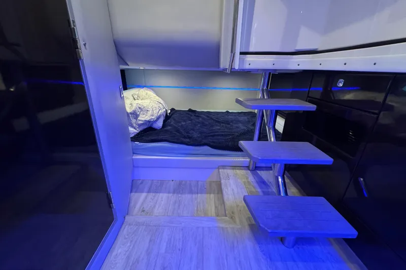 Slide: The Image of 2020 Formula 400 Super Sport Crossover interior with modern blue-lit cabin and wooden steps. - 49