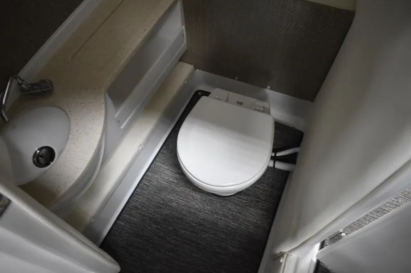 Slide: The Image of Compact bathroom in 2021 Cobalt R7 boat with sink and toilet. - 5