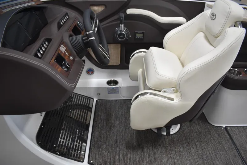 Slide: The Image of 2021 Cobalt R7 boat interior with luxurious white captain's chair and sleek dashboard. - 6