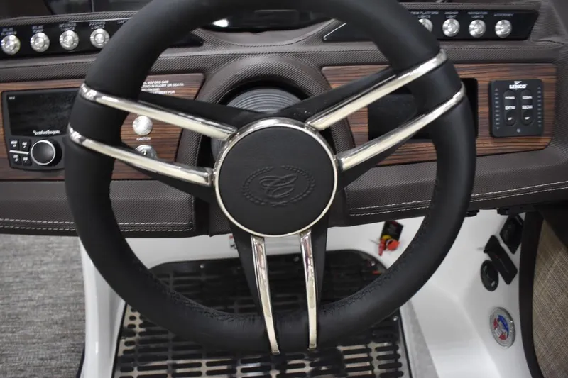 Slide: The Image of Steering wheel of 2021 Cobalt R7 boat with modern dashboard controls. - 7