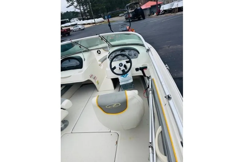 Slide: The Image of 2008 Sea Ray 205 Sport boat interior with steering wheel and seating. - 10