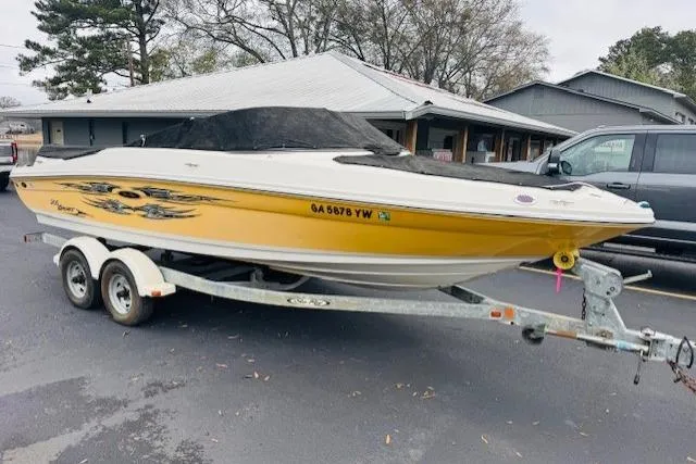 The Image of 2008 Sea Ray 205 Sport boat in yellow on a trailer, parked outdoors. - 5