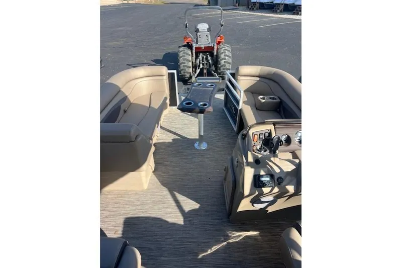Slide: The Image of 2021 Bennington 22 SSRX pontoon boat interior with seating and control panel. - 3
