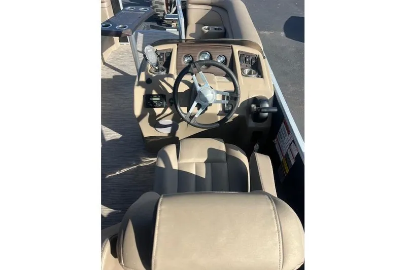 Slide: The Image of 2021 Bennington 22 SSRX boat interior with steering wheel and dashboard controls. - 4