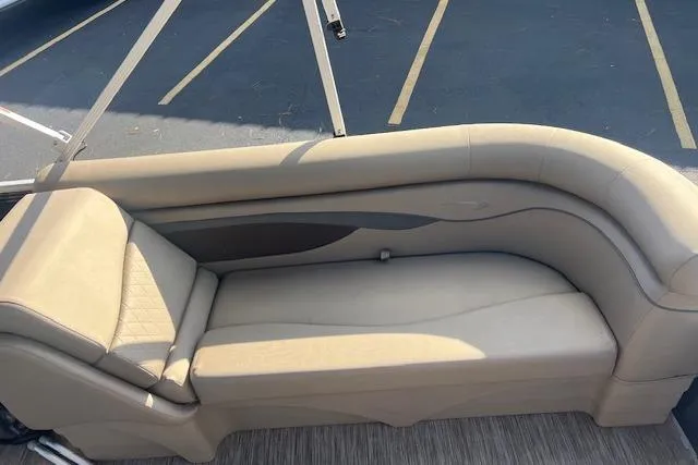 Slide: The Image of 2021 Bennington 22 SSRX boat seating with beige upholstery and sleek design. - 5