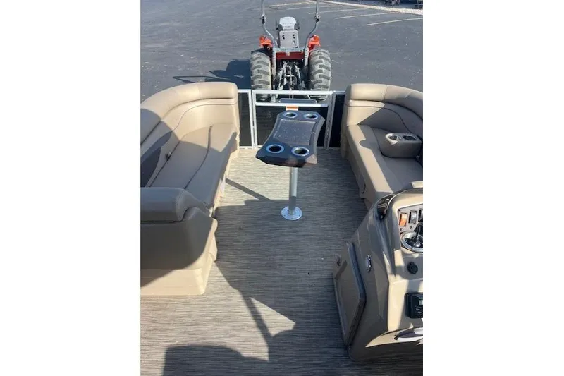Slide: The Image of Interior of a 2021 Bennington 22 SSRX pontoon boat with seating and table. - 8