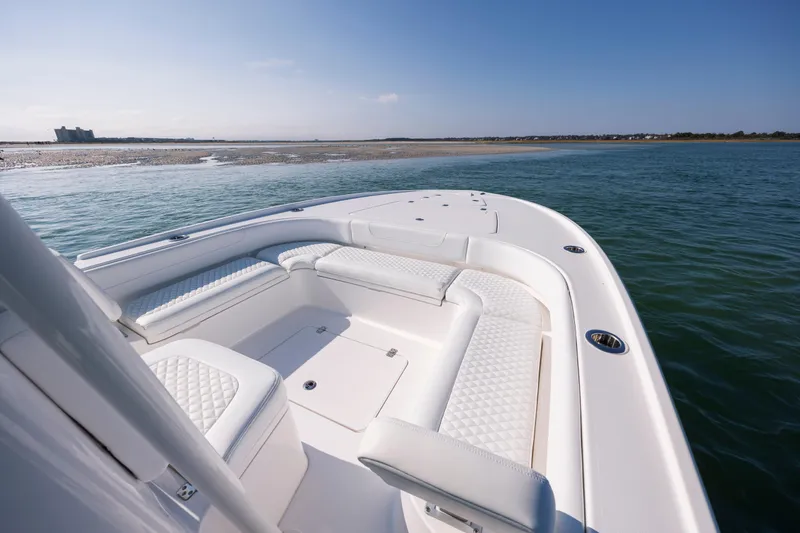 Slide: The Image of Luxurious Caymas 26 HB boat from 2026 on calm waters. - 10