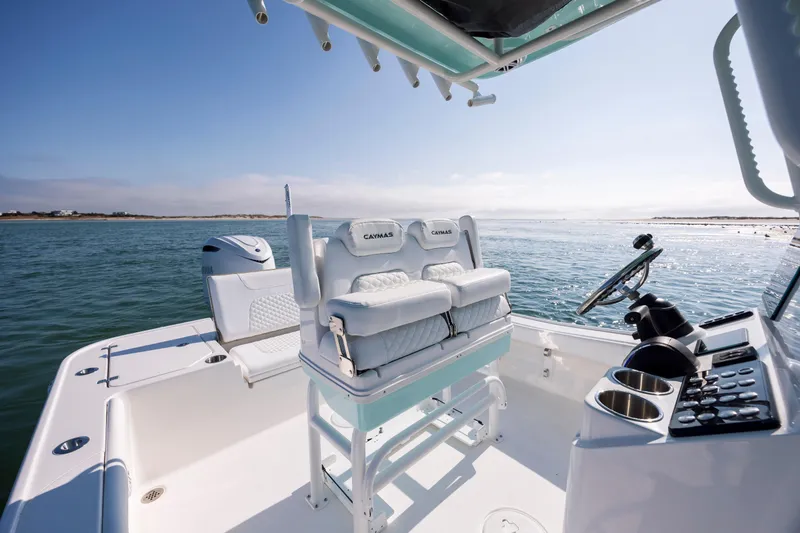 Slide: The Image of Caymas 26 HB 2026 boat on calm waters. - 17