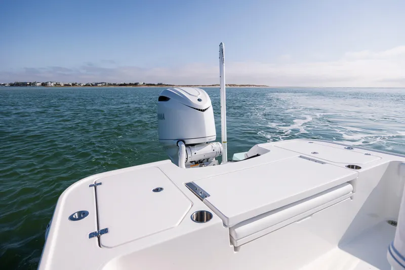 Slide: The Image of Caymas 26 HB 2026 boat on calm waters. - 19