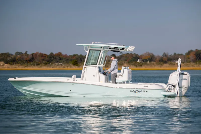 Slide: The Image of 2026 Caymas 26 HB boat on calm water. - 3