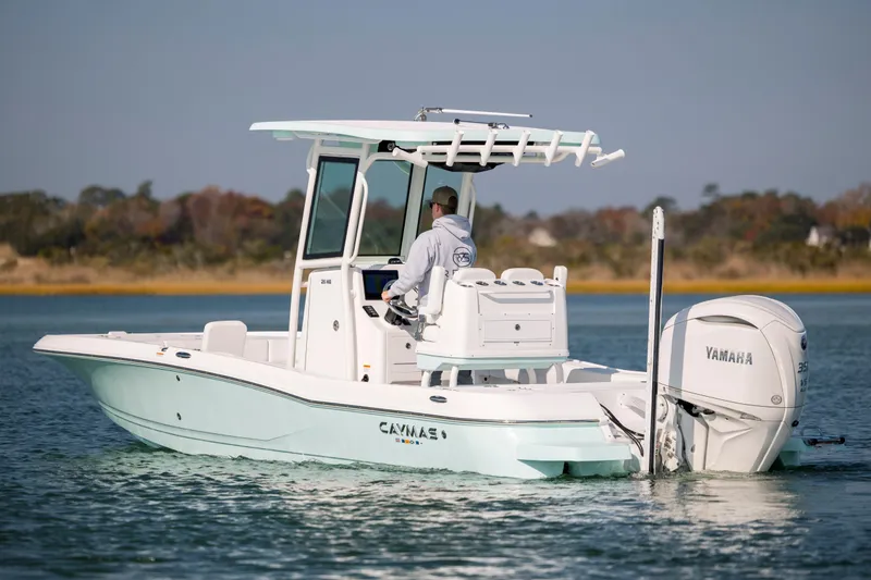 Slide: The Image of Caymas 26 HB 2026 boat on calm water with Yamaha engine. - 4