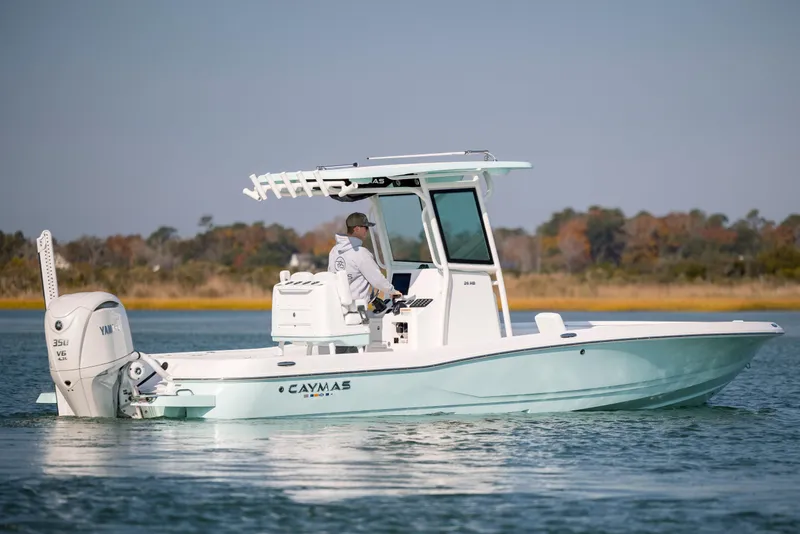 Slide: The Image of 2026 Caymas 26 HB boat on calm water. - 6