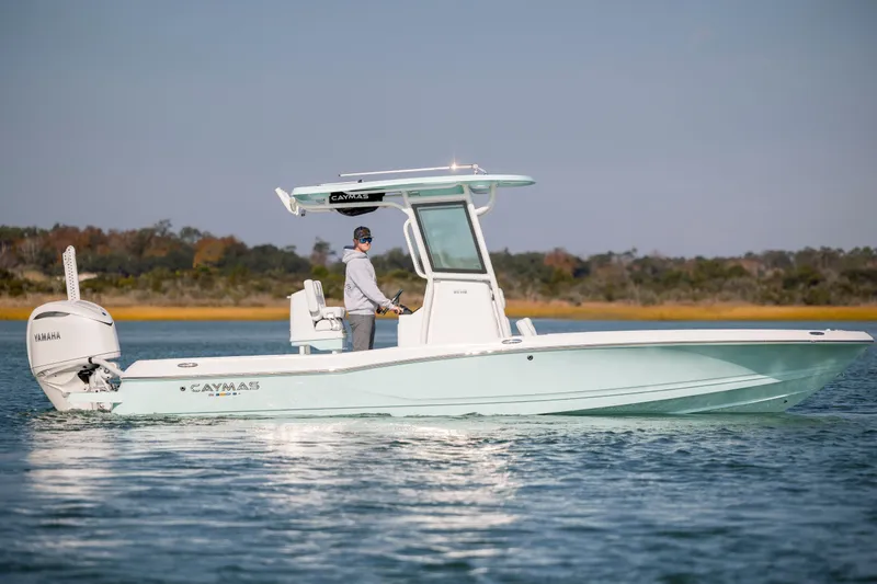 Slide: The Image of 2026 Caymas 26 HB boat on calm water. - 7