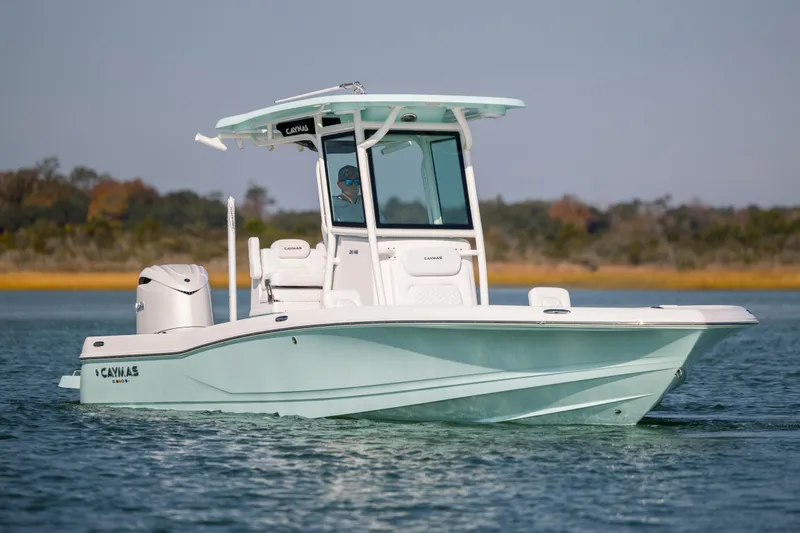 Slide: The Image of 2026 Caymas 26 HB boat on calm water. - 8
