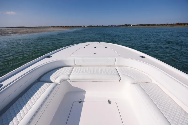 Slide: The Image of 2026 Caymas 26 HB boat on calm waters. - 9