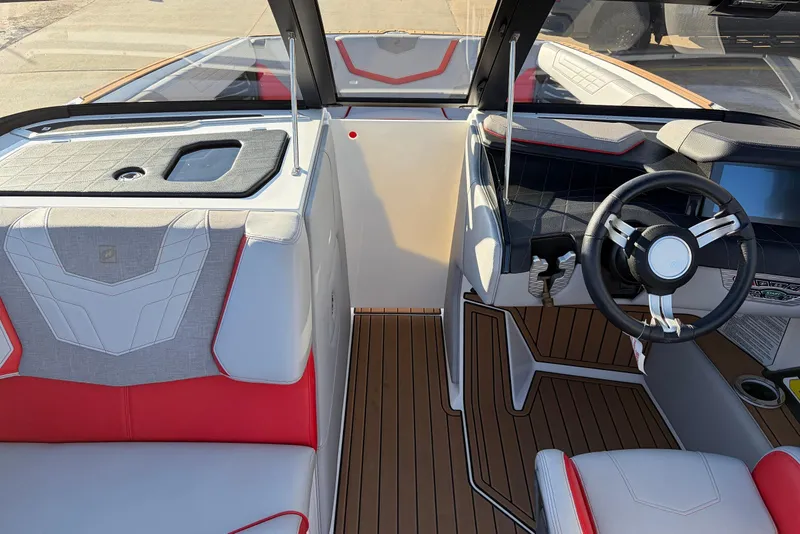 Slide: The Image of 2021 Nautique Super Air Nautique G23 interior with modern dashboard and seating. - 22