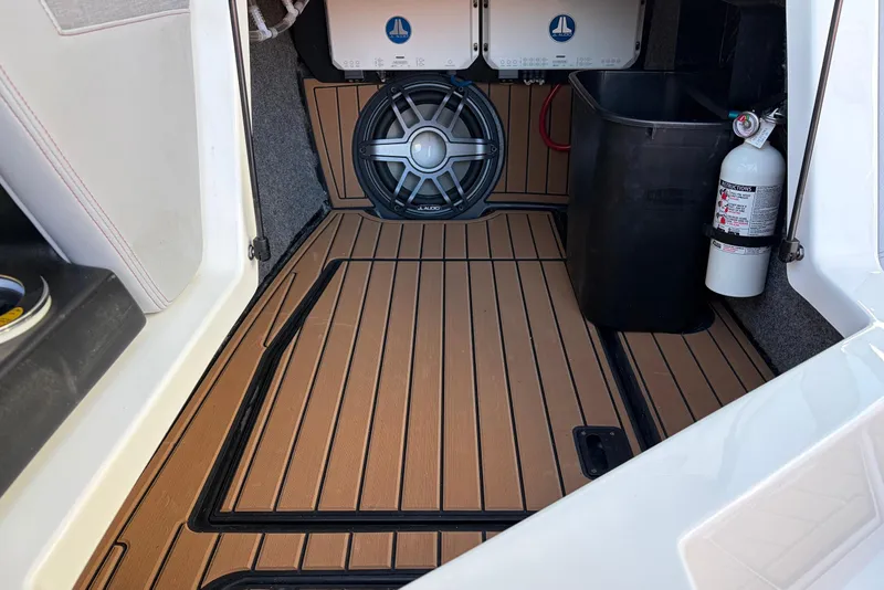 Slide: The Image of 2021 Nautique Super Air Nautique G23 interior with JL Audio speaker and fire extinguisher. - 30