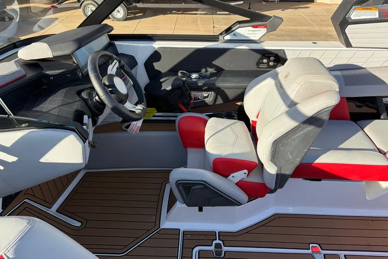 Slide: The Image of 2021 Nautique Super Air Nautique G23 interior with modern helm and luxurious seating. - 48