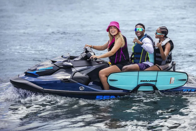 Slide: The Image of Manufacturer Provided Image: Three people enjoying a ride on a 2026 Sea-Doo GTX 300 jet ski. - 3