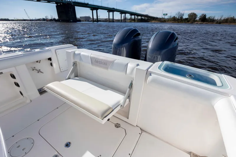 Slide: The Image of 2015 Everglades 255 Center Console boat with dual engines on a sunny day. - 10