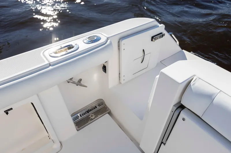 Slide: The Image of 2015 Everglades 255 Center Console boat interior with water in background. - 11
