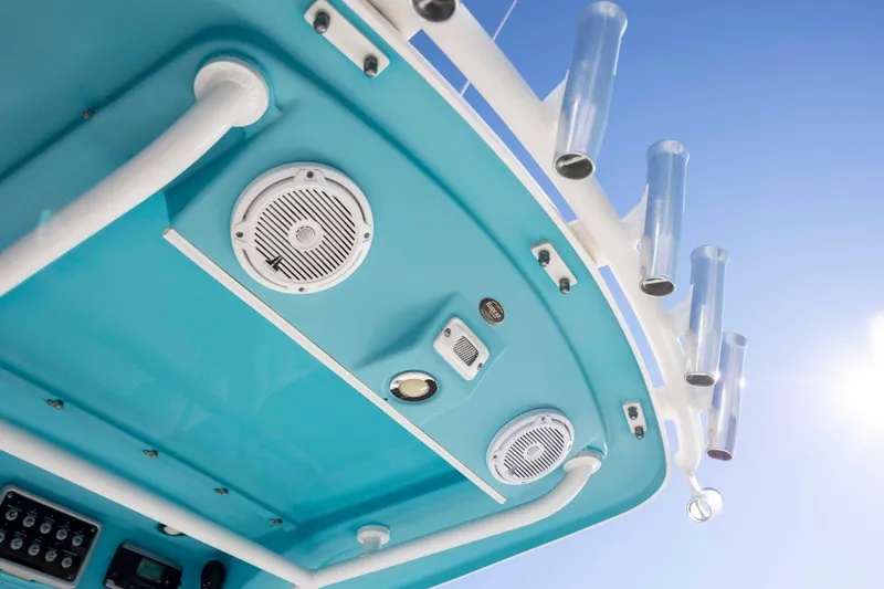 Slide: The Image of 2015 Everglades 255 Center Console boat roof with speakers and rod holders. - 20