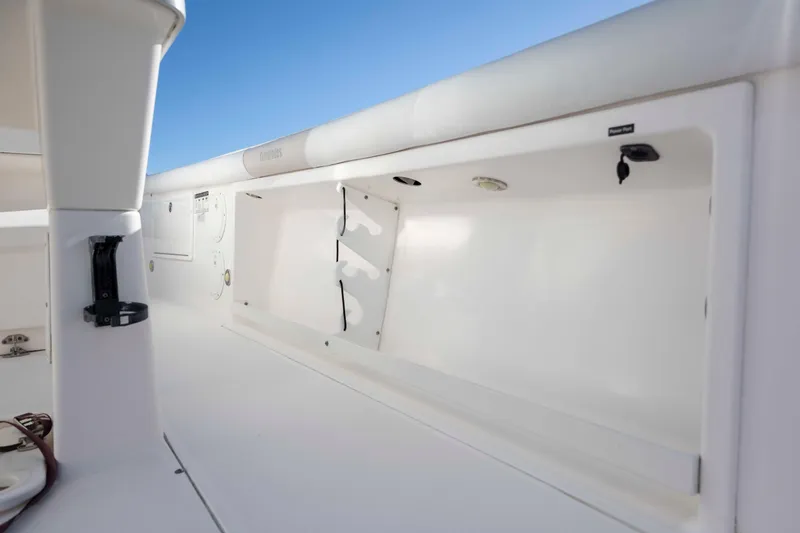 Slide: The Image of 2015 Everglades 255 Center Console boat interior with storage compartments. - 21