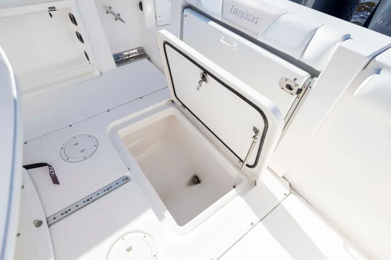 Slide: The Image of Open storage compartment on 2015 Everglades 255 Center Console boat. - 28