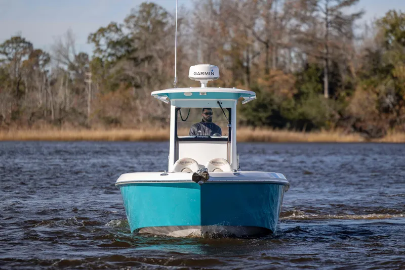 Slide: The Image of 2015 Everglades 255 Center Console boat cruising on a scenic waterway. - 7