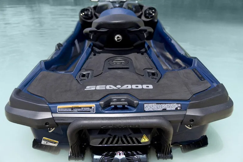 Slide: The Image of Manufacturer Provided Image: 2026 Sea-Doo GTX 230 jet ski in water, rear view, showcasing sleek design. - 3