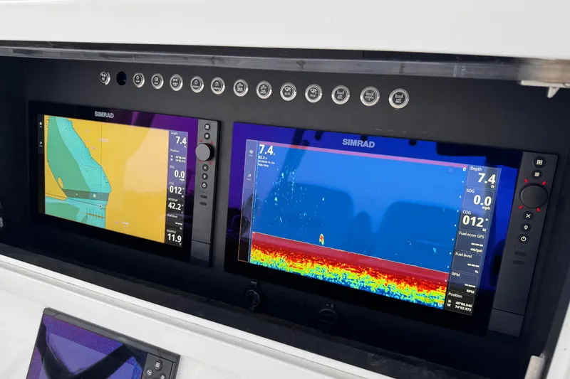 Slide: The Image of Simrad navigation displays on 2019 Onslow Bay 33 TE boat dashboard. - 13