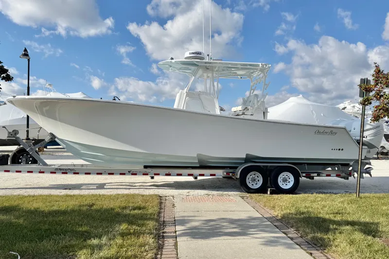 Slide: The Image of 2019 Onslow Bay 33 TE boat on trailer under blue sky. - 4